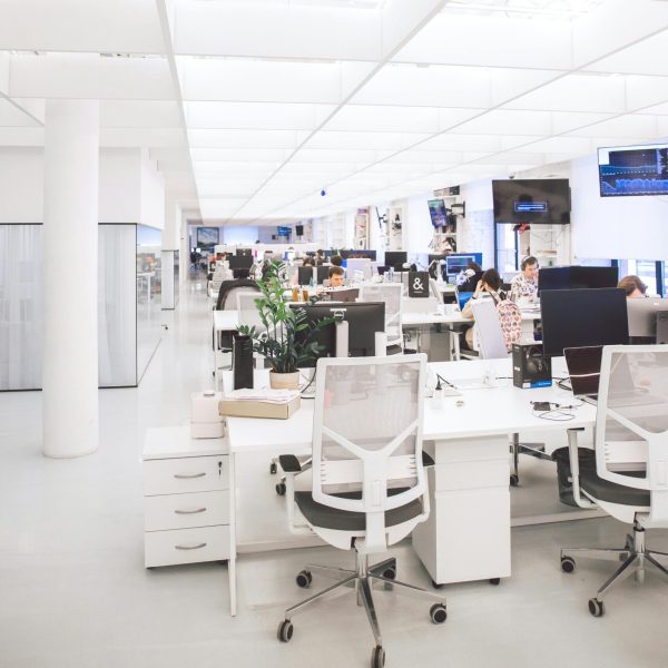 pexels-photo-3778619-3778619 Spacious and well-lit office interior with modern furniture and workstations, ideal for a dynamic work environment.